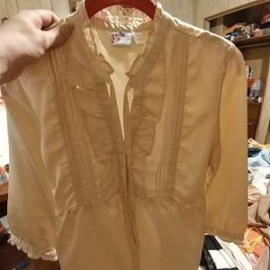 A gold colored silk wt polyester blend that is so